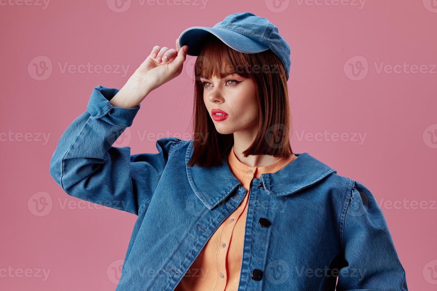 Positive young woman denim cap red lips glamor fashion studio model unaltered photo