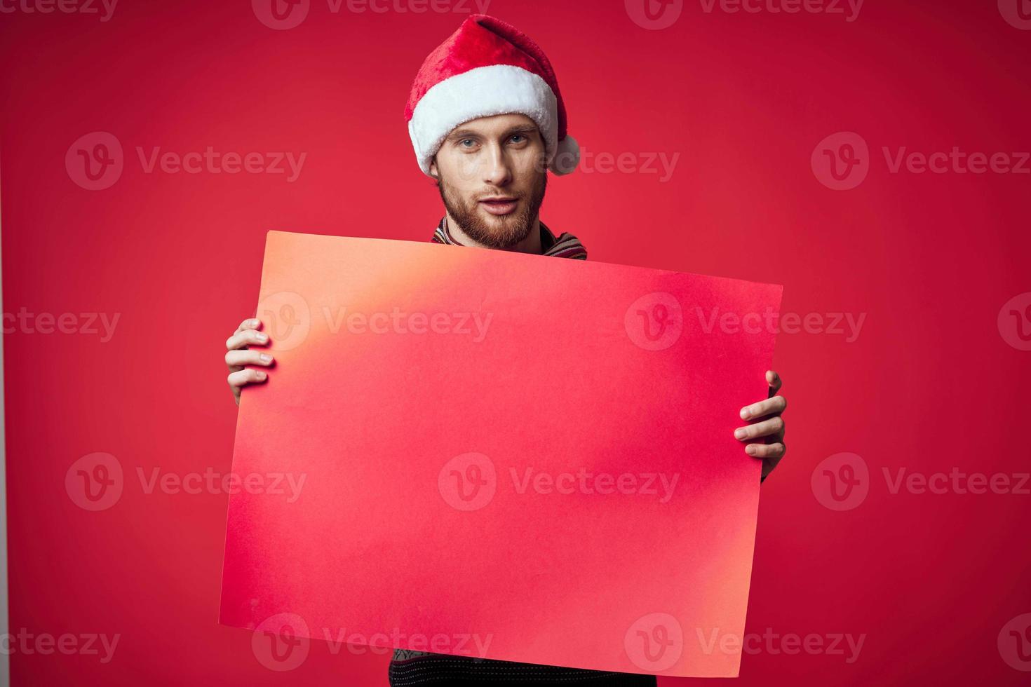 handsome man in New Year's clothes advertising copy space red background photo