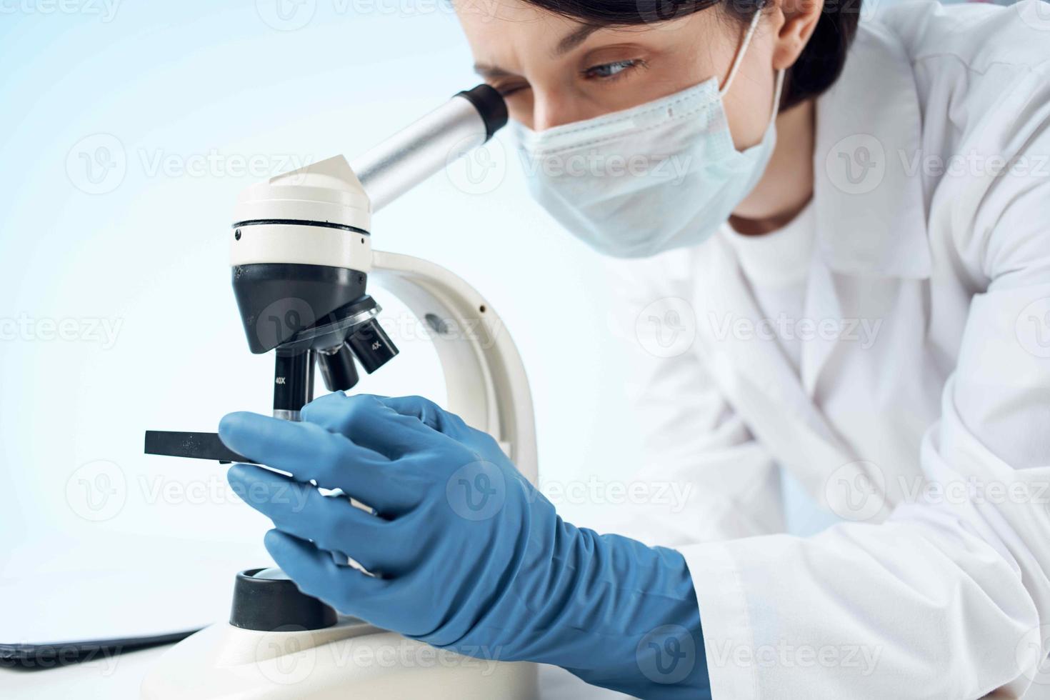woman wearing medical mask microscope laboratory technology professional photo