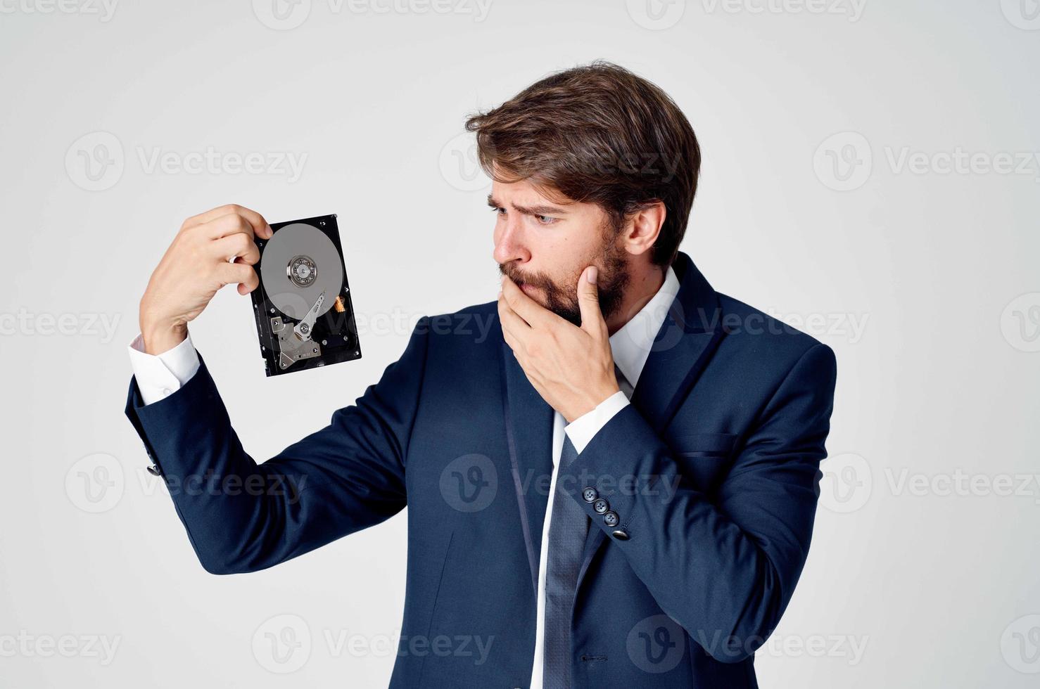 business man in suit and technology hard drive information photo