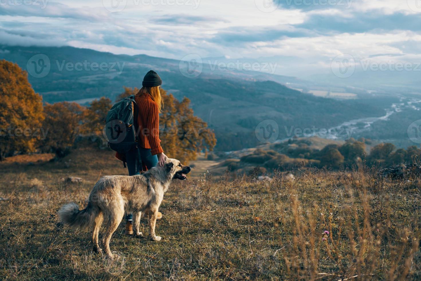 cheerful woman tourist next to dog and walk friendship journey photo