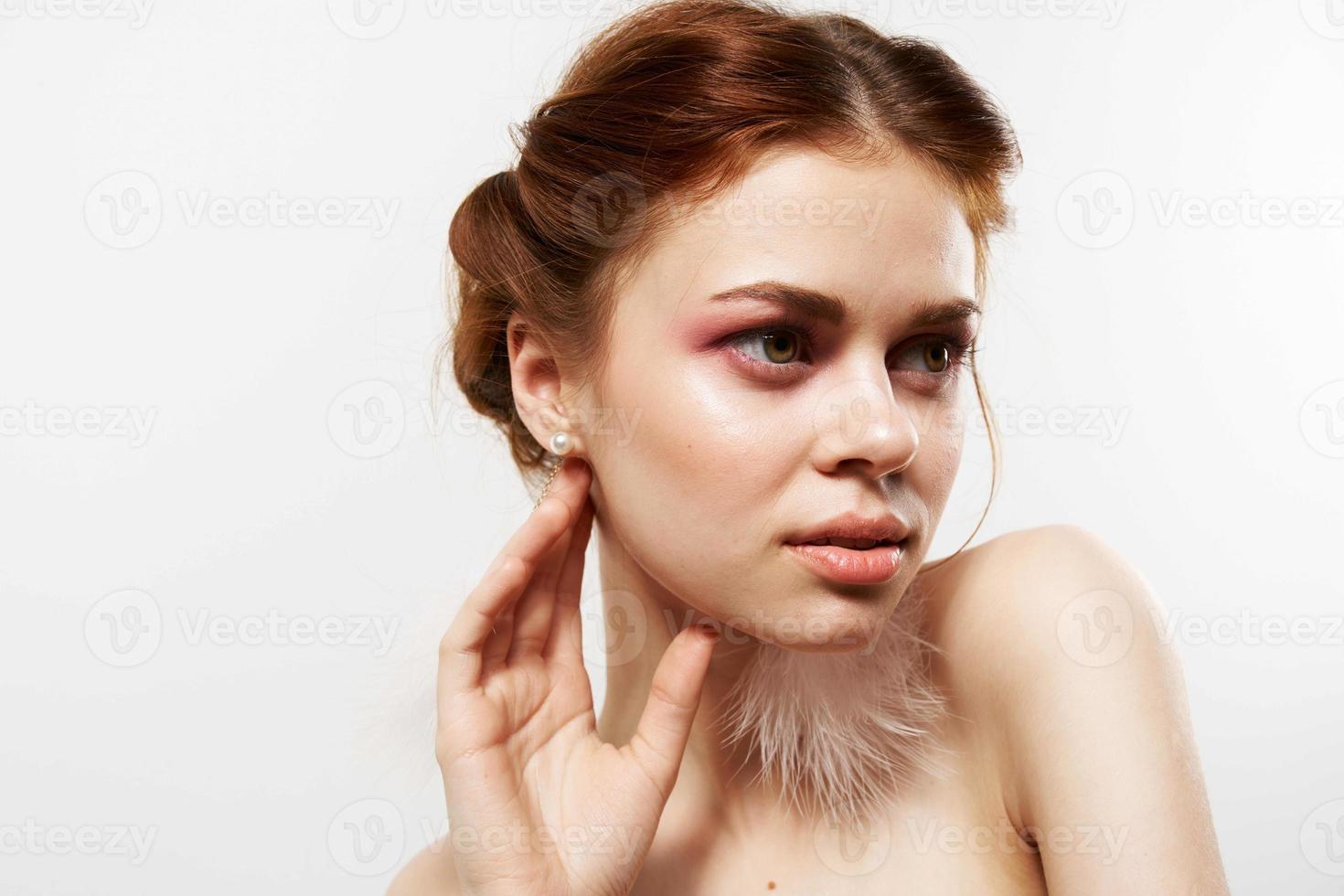 cheerful woman bare shoulders bright makeup fluffy earrings Studio photo