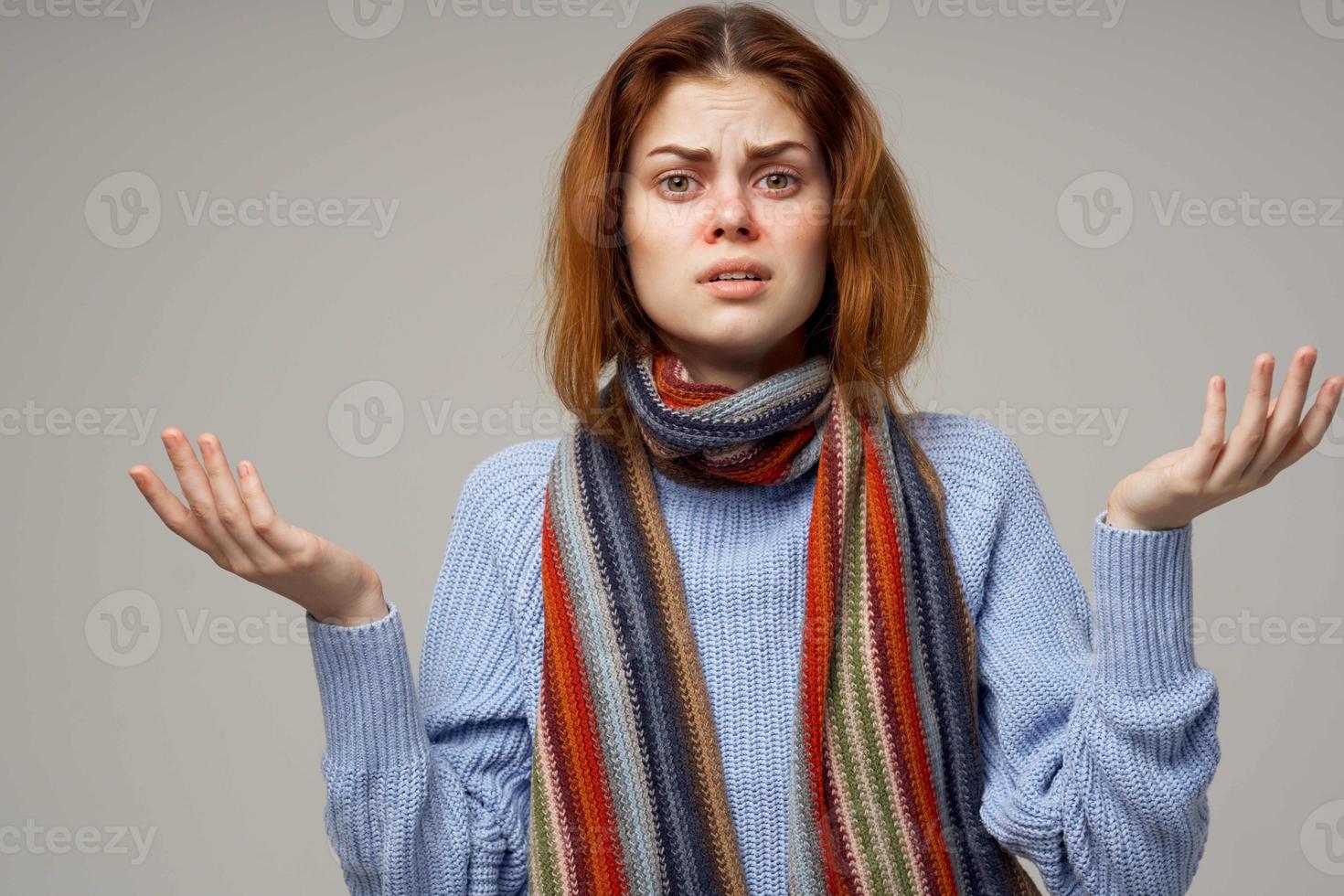 red-haired woman neck scarf cold handkerchief light background photo