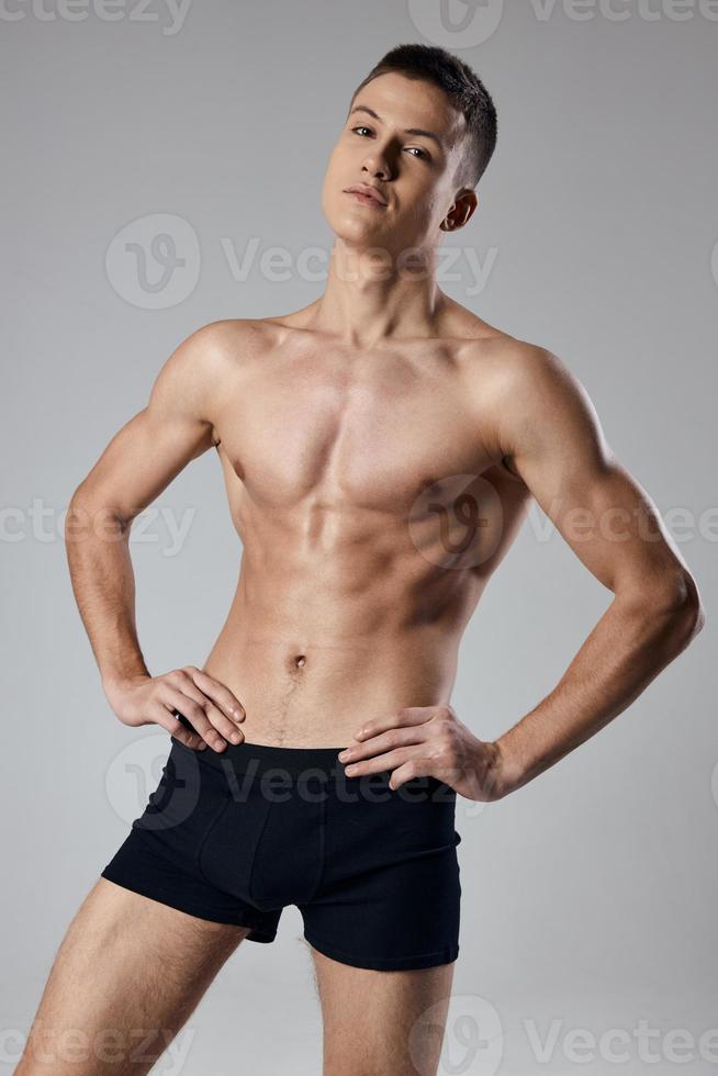 strong athlete with bulging arm muscles naked back gray background 22392017  Stock Photo at Vecteezy