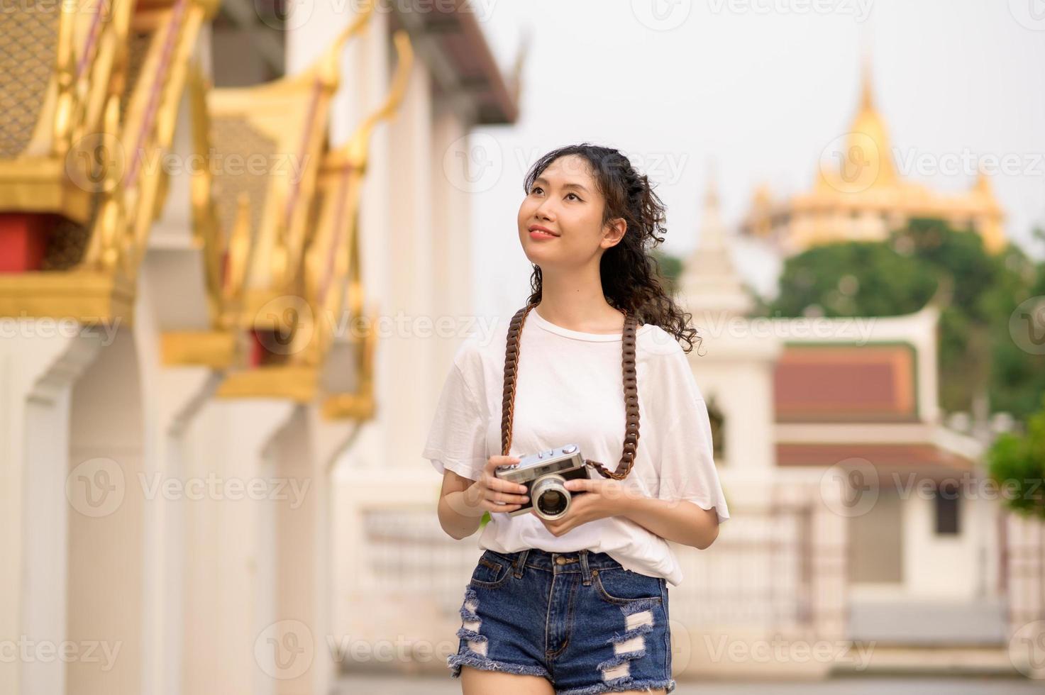 Beautiful young Asian tourist woman on vacation sightseeing and exploring Bangkok city, Thailand, Holidays and traveling concept photo