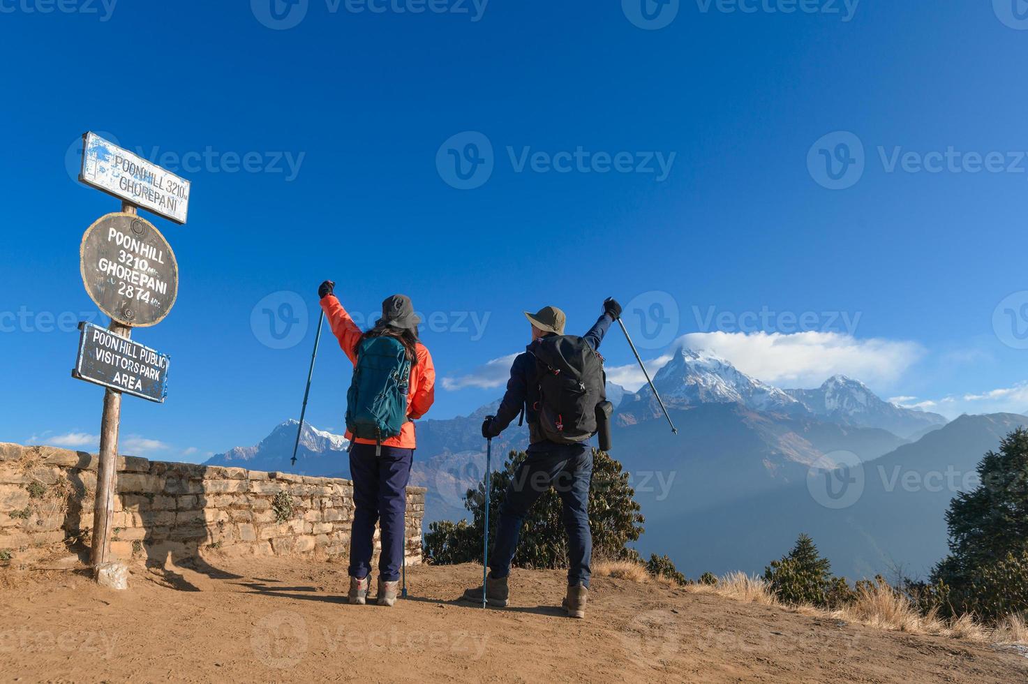 A young traveller trekking in Poon Hill view point in Ghorepani, Nepal photo