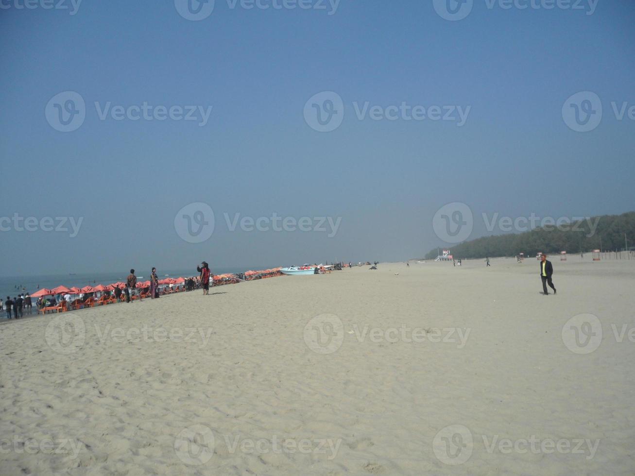 Photo of a sunny day view of a beautiful winter beach and sea on a sunny day in Innany beach of Cox's Bazar, Bangladesh. Travel and Vacation.