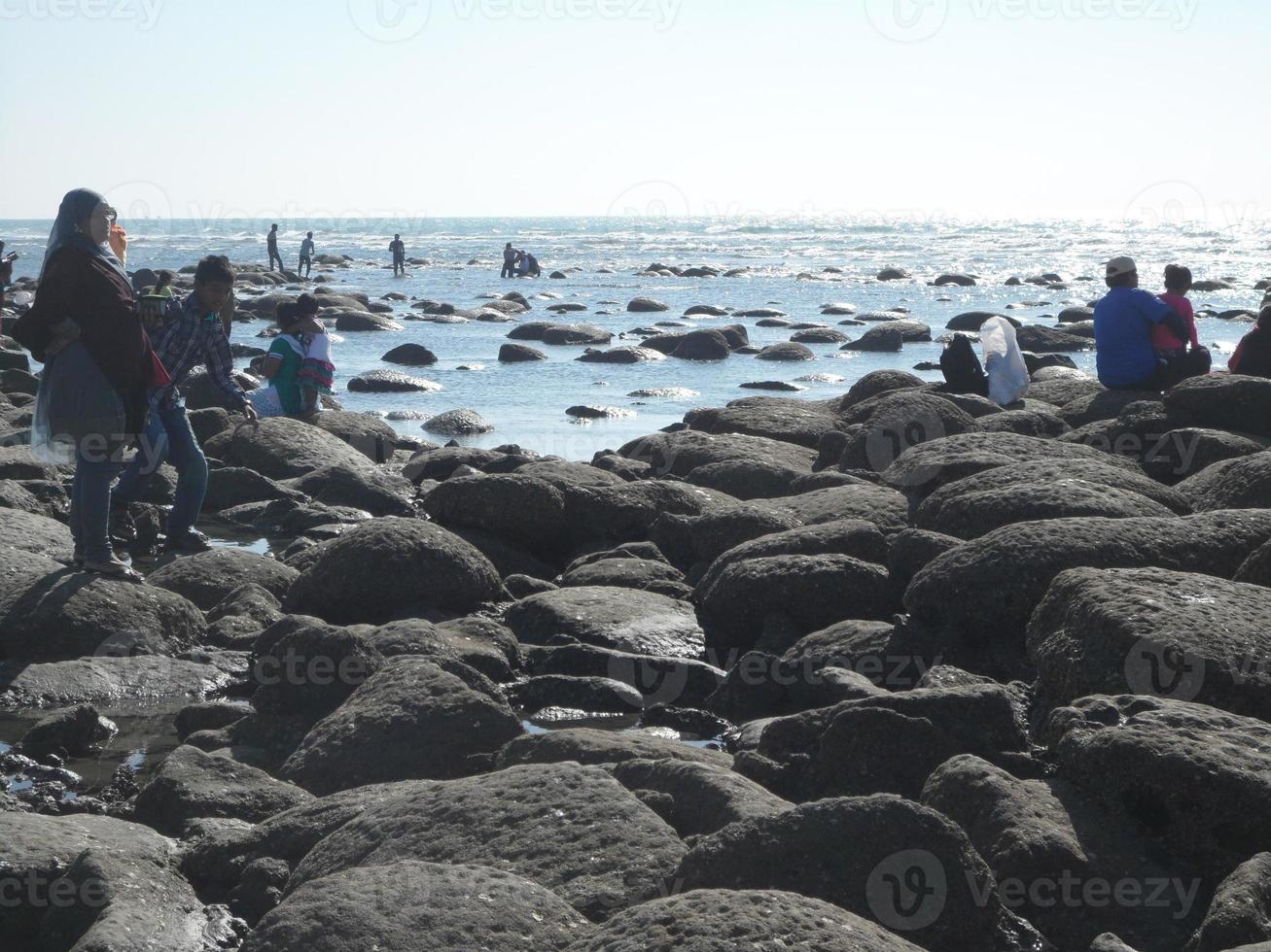 Photo of a sunny day view of a beautiful winter beach and sea on a sunny day in Innany beach of Cox's Bazar, Bangladesh. Travel and Vacation.