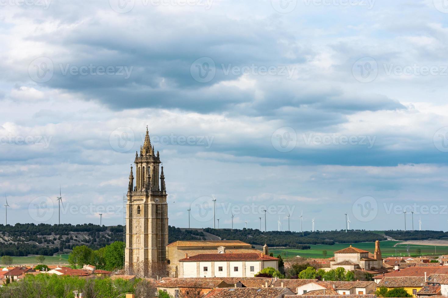 gothic catholic church tower in medieval village photo