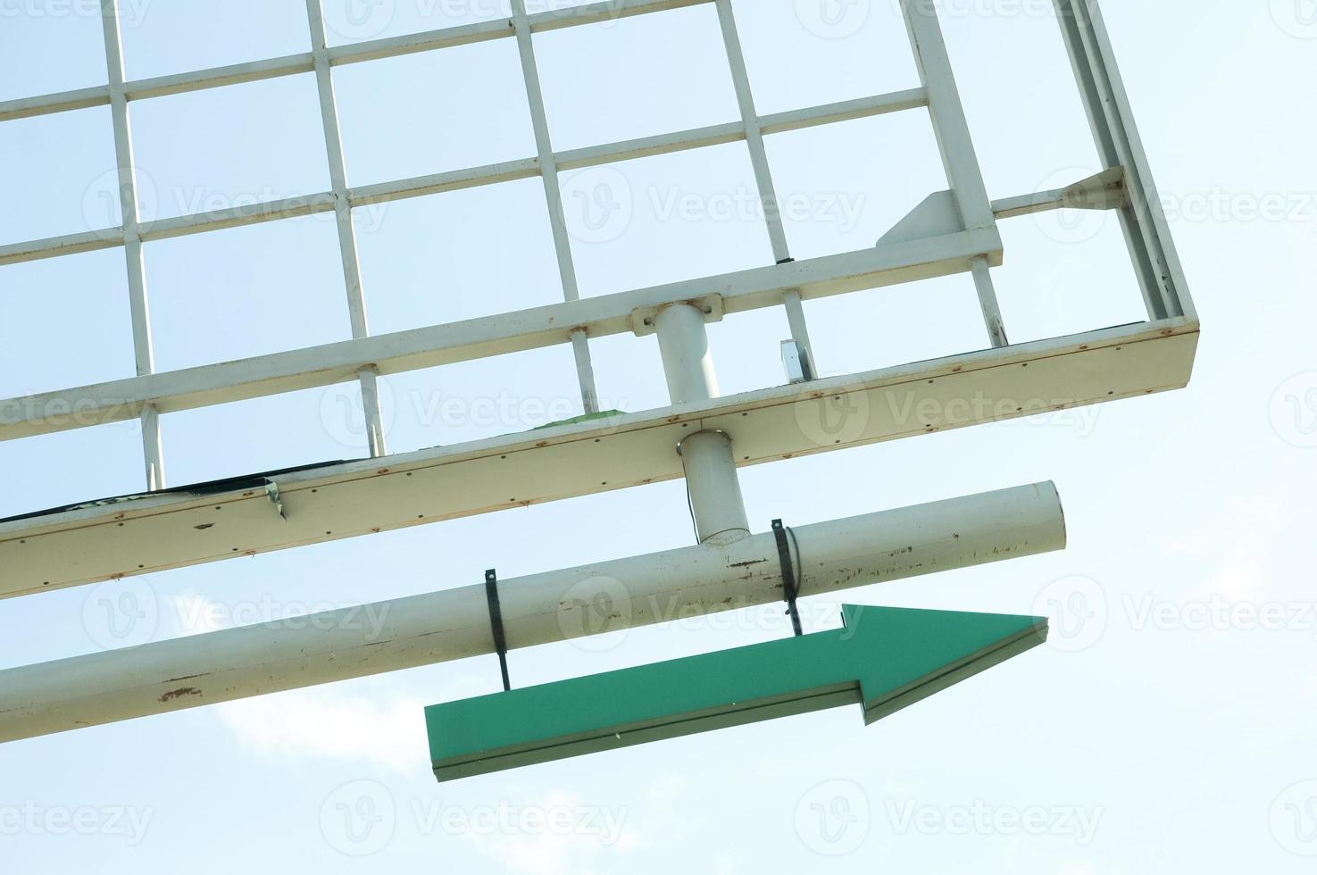 Empty billboard frame with a green arrow attached. photo