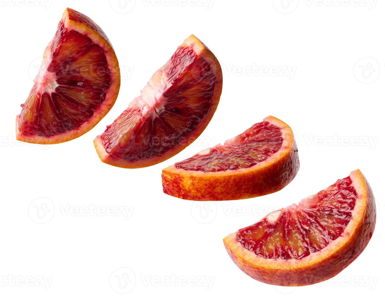 Juicy piece of red orange on a white isolated background photo