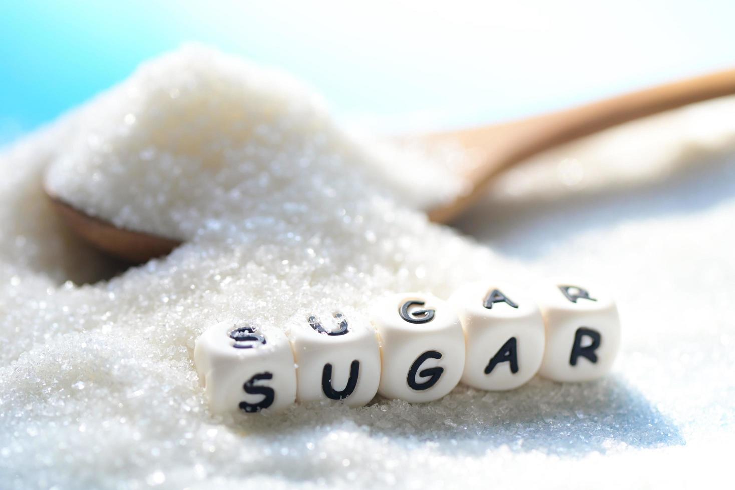 No sugar concept, Sugar on spoon and blur background, white sugar for food and sweets dessert candy heap of sweet sugar crystalline granulated photo