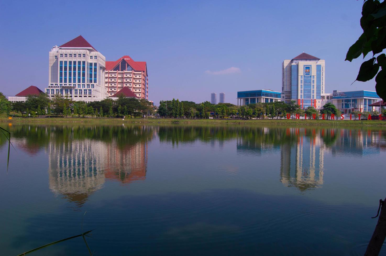 Surabaya, Indonesia, June 2022 - landscape of the Unesa building across from the reservoir photo