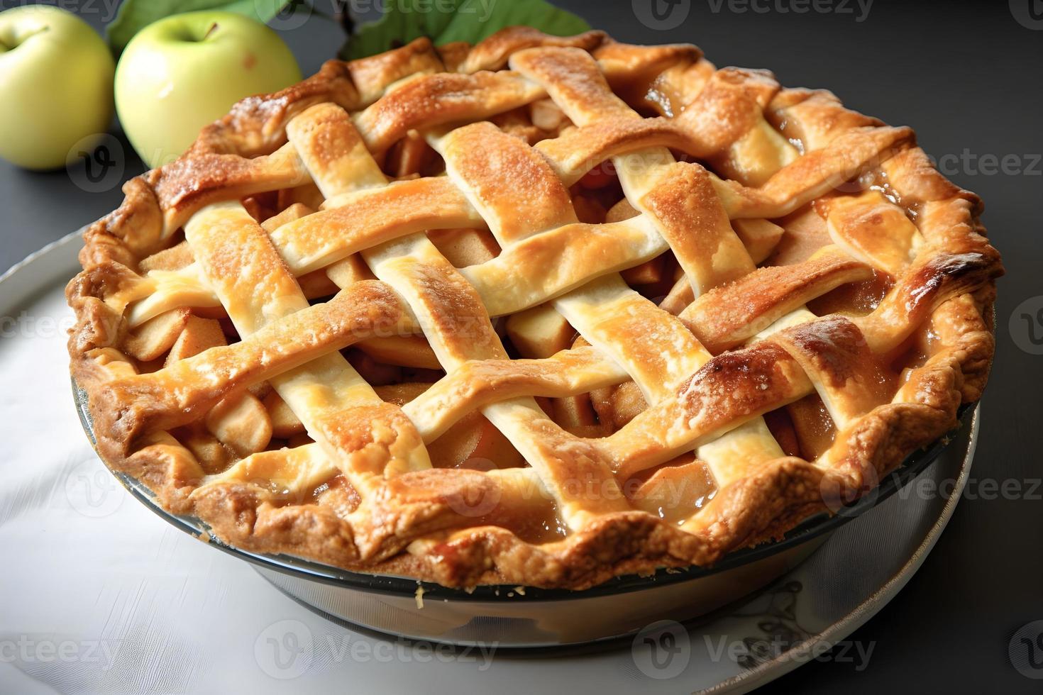 A pie with a lattice crust sits on a table photo