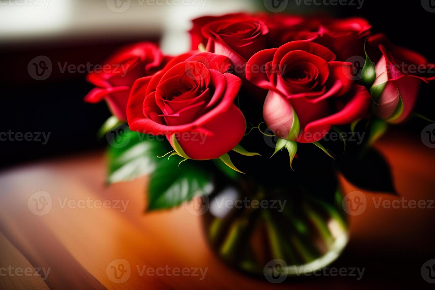 Red roses in a glass flower vase on the table for Mother's Day and Valentine's Day photo