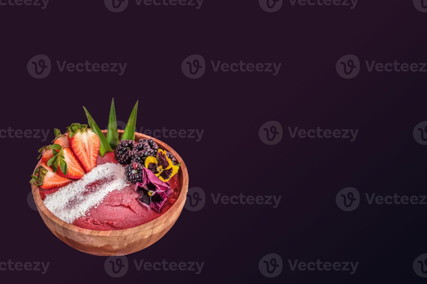 acai bowl with colorful gradient food, fruits background. Summer acai smoothie wooden bowl with strawberries, blackberries. photo