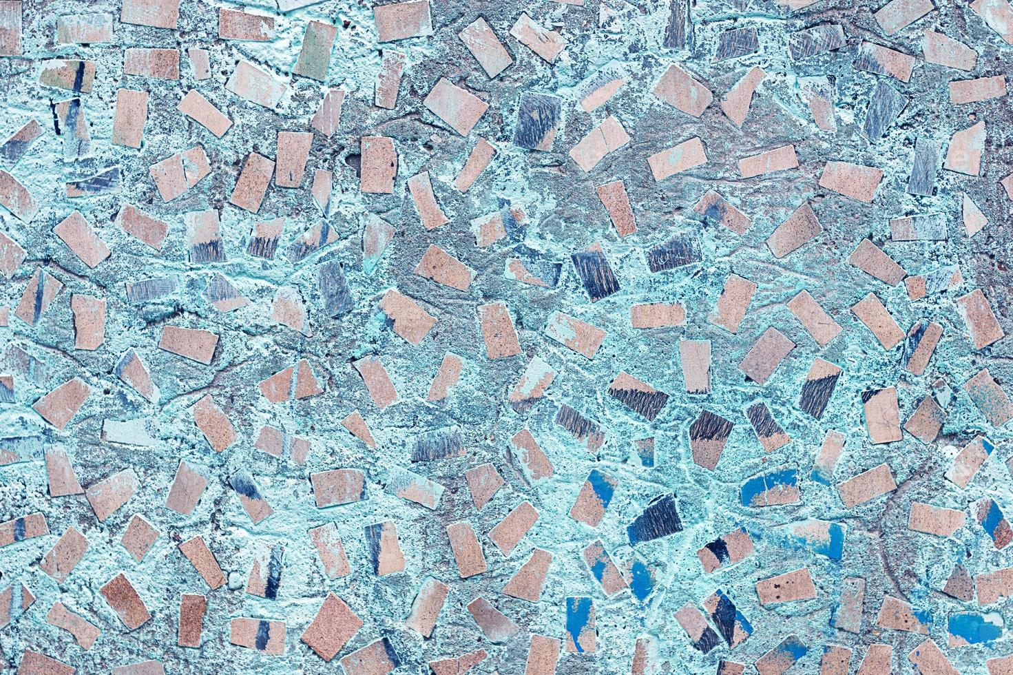 abstract texture of concrete wall with random mosaic pattern photo