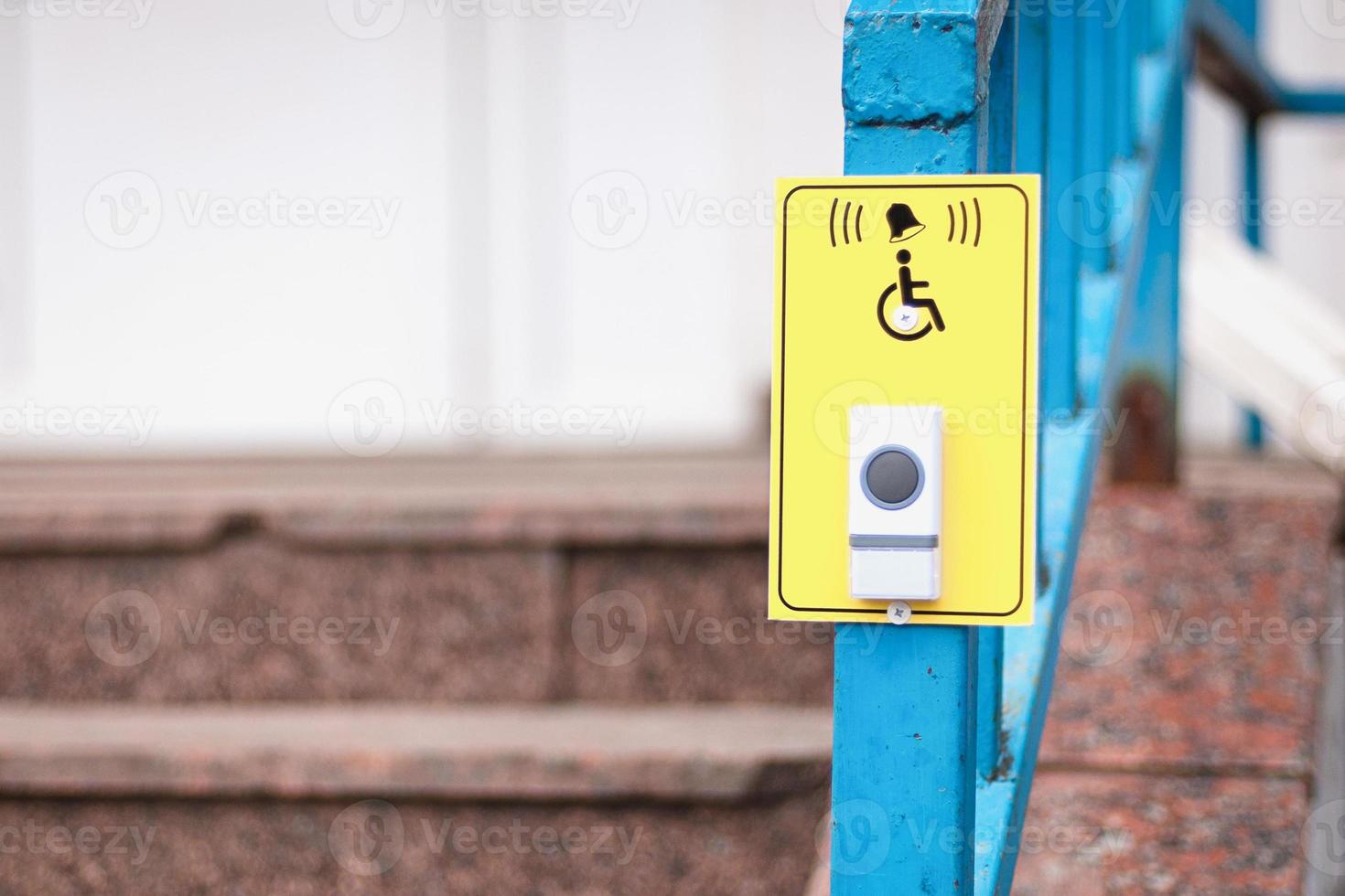 Bell button and disabled person sign for pharmacy customers photo