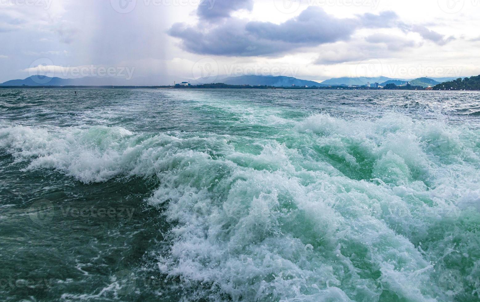 Travel Thailand by ferry boat yacht waves through tropical landscape. photo