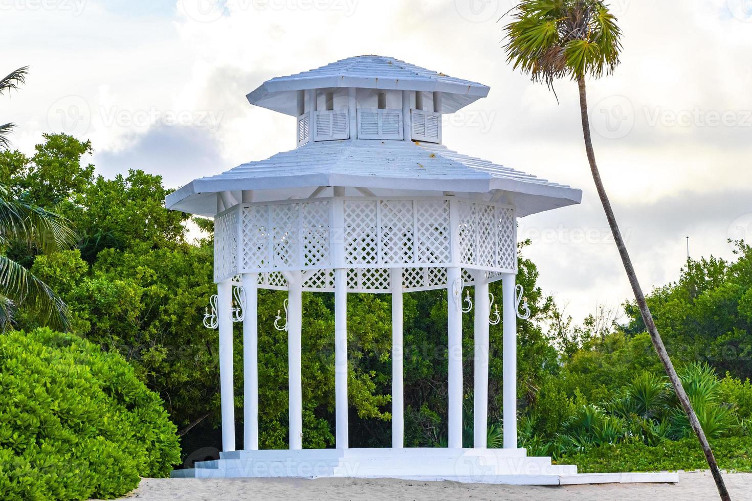 White noble pergula pavilion in paradise on beach palms Mexico. photo