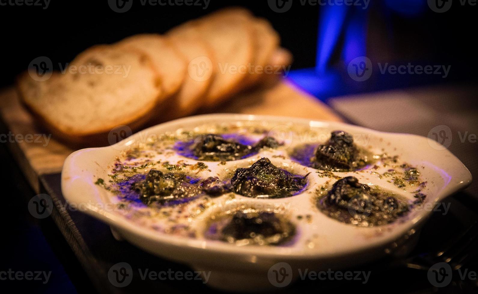 Escargot with french bread photo