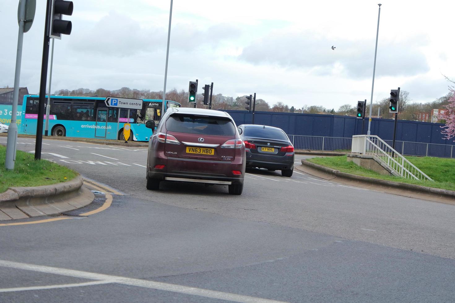 Low Angle View of British Road and Traffic at Luton Town of England UK. The Image Was Captured at Central Luton  City During a Cold and Cloudy Evening of 24-March-2023 photo