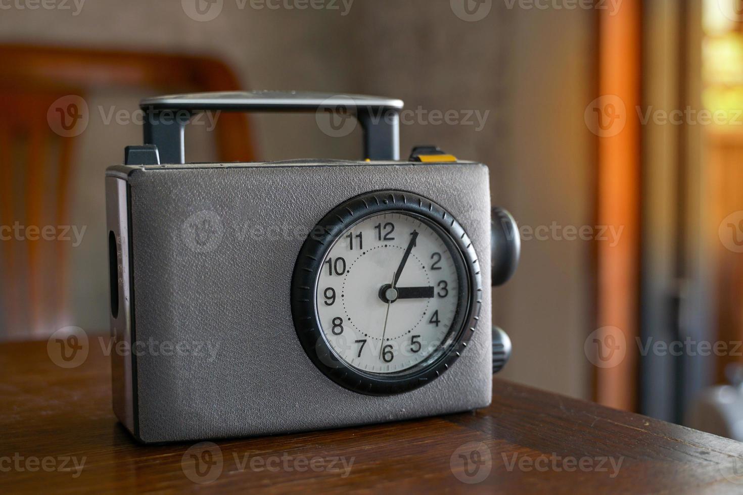 Gray antique old transistor radio with handle, front design has a needle clock, suitable for collecting. put on show home decoration Decorate the shop in a beautiful vintage style. photo