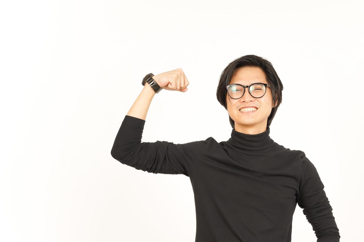 Showing strength arm Of Handsome Asian Man Isolated On White Background photo