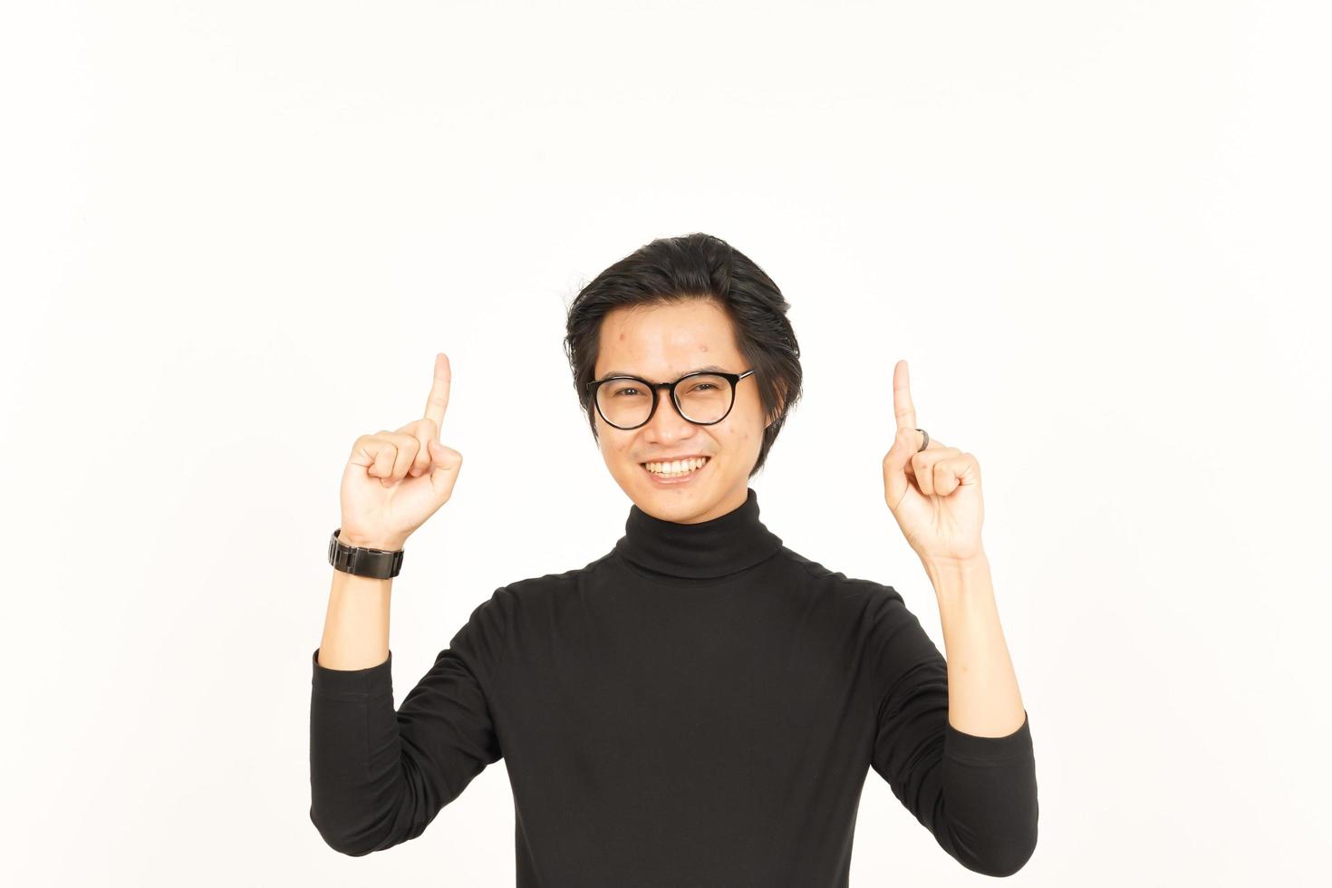 Showing Product and Pointing Up Of Handsome Asian Man Isolated On White Background photo