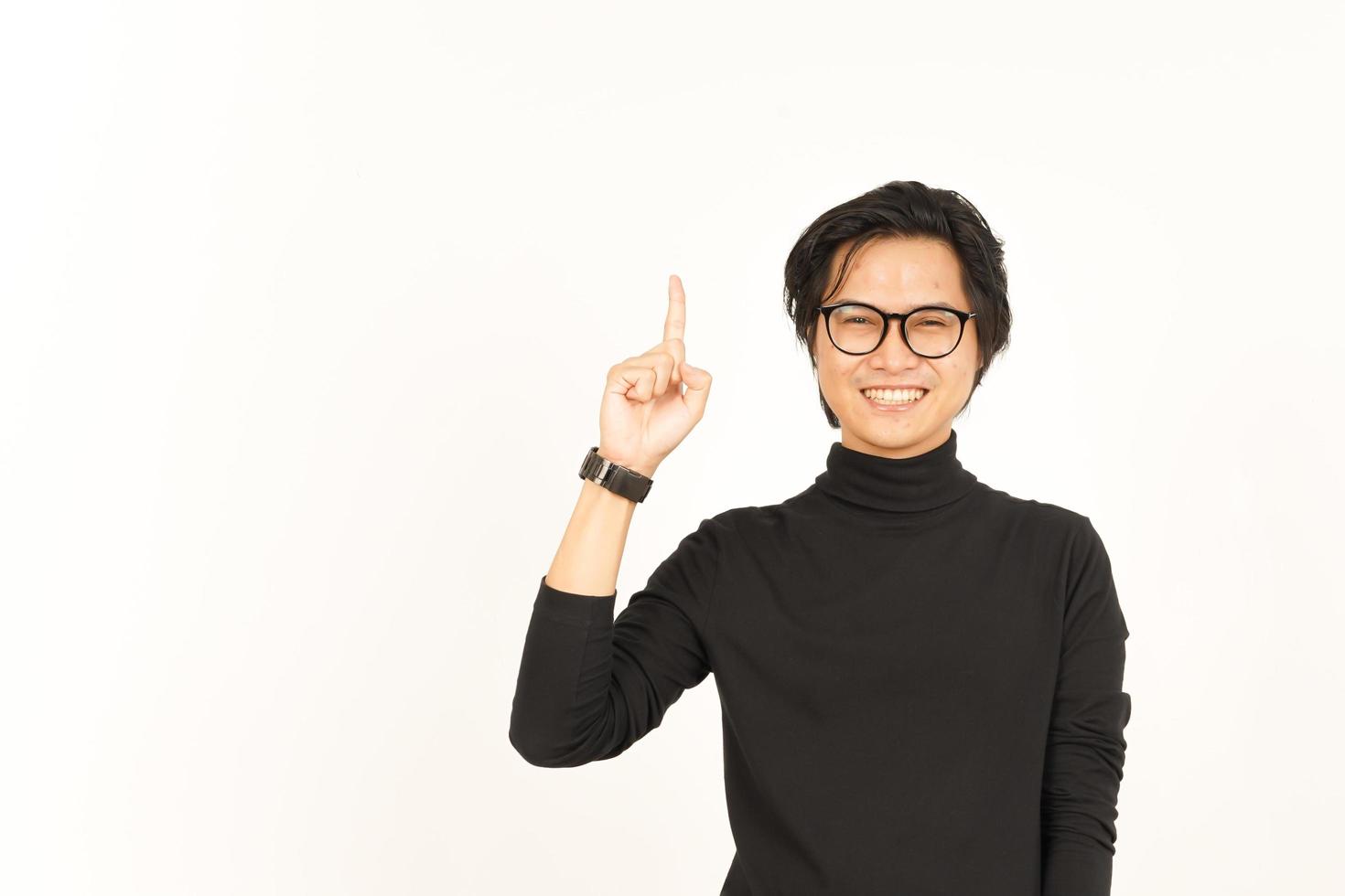 Showing Product and Pointing Up Of Handsome Asian Man Isolated On White Background photo