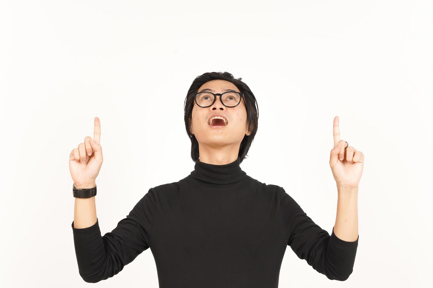 Showing Product and Pointing Up Of Handsome Asian Man Isolated On White Background photo