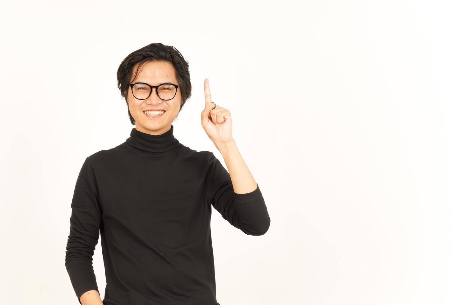 Showing Product and Pointing Up Of Handsome Asian Man Isolated On White Background photo
