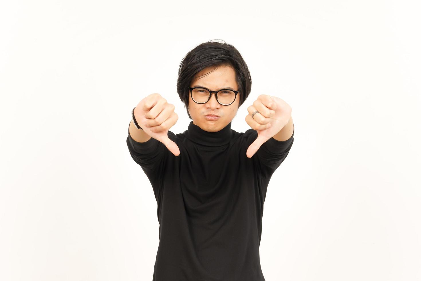 Showing Thumbs Down Of Handsome Asian Man Isolated On White Background photo