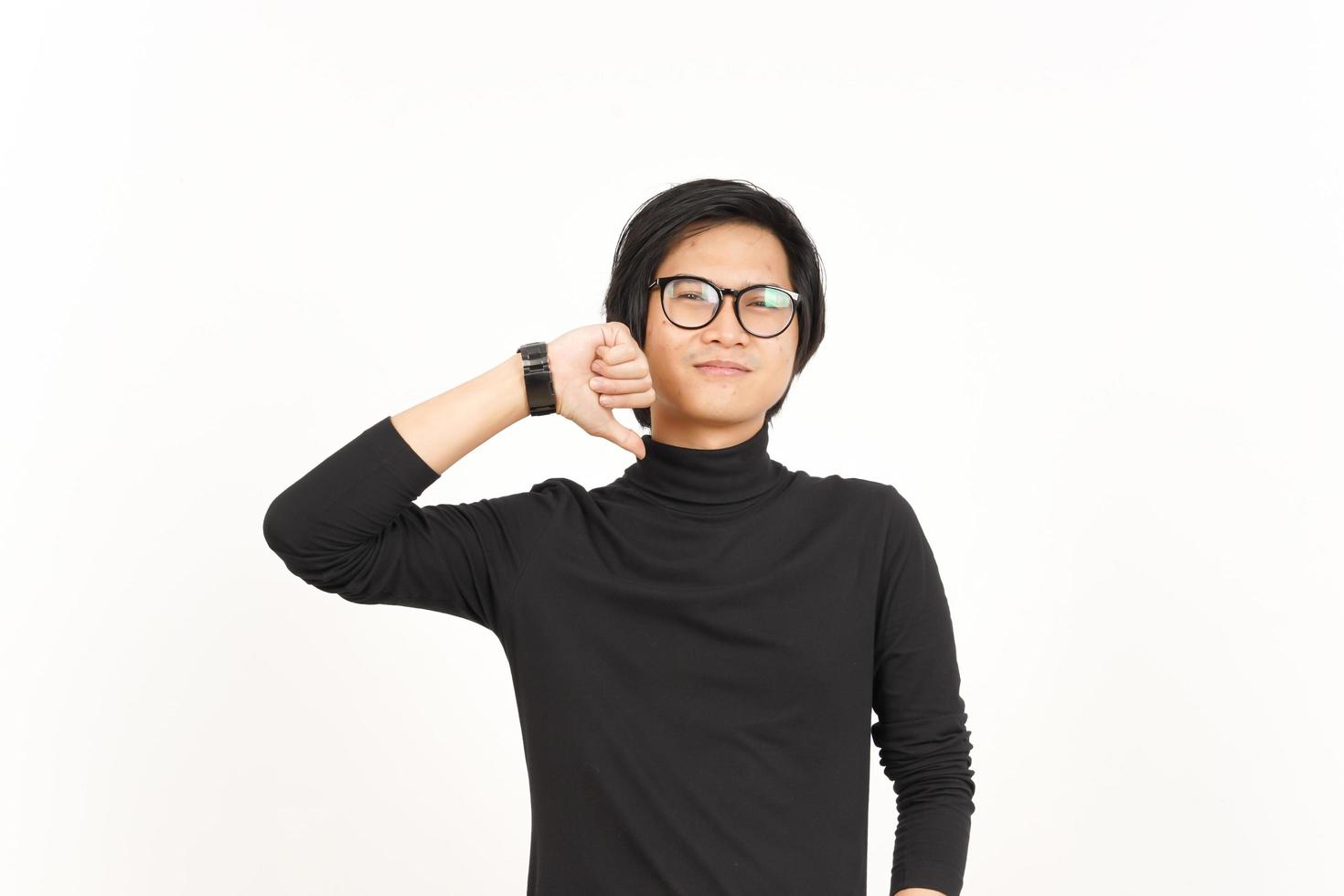 Showing Thumbs Down Of Handsome Asian Man Isolated On White Background photo