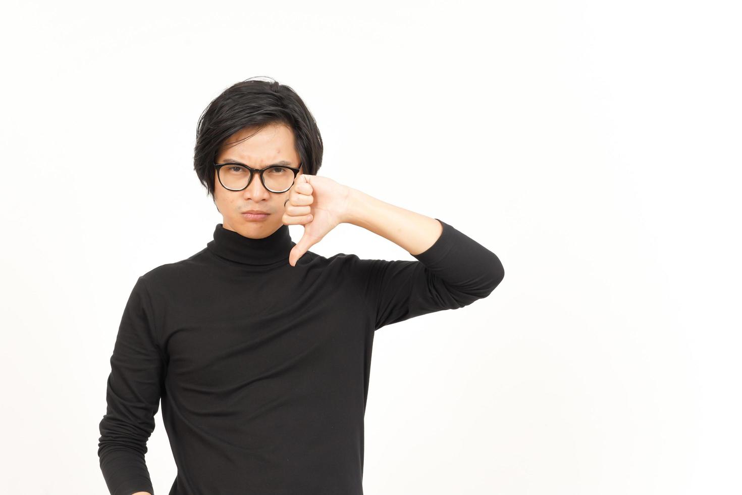 Showing Thumbs Down Of Handsome Asian Man Isolated On White Background photo