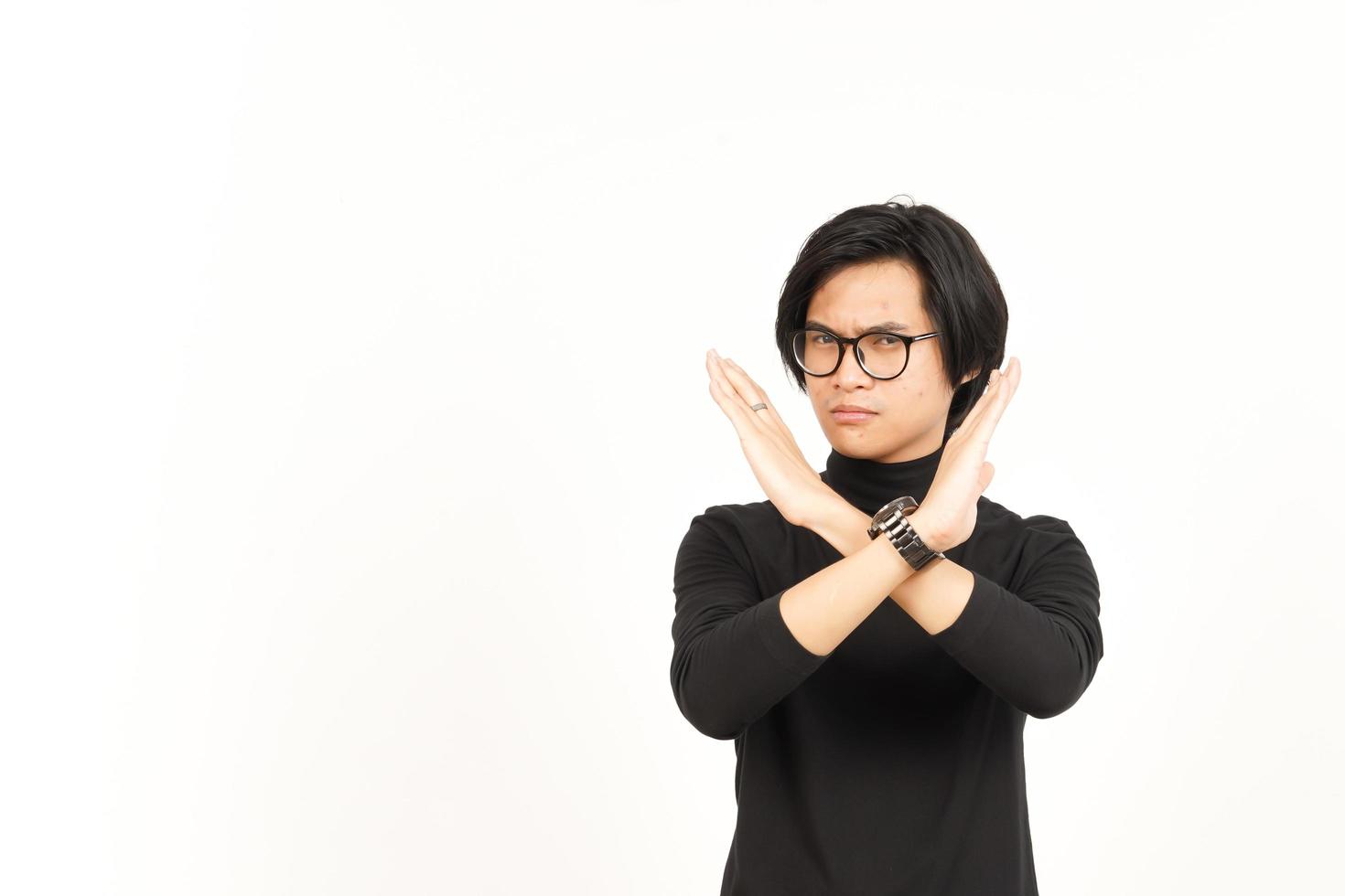 Crossed Hand For Rejection Gesture Of Handsome Asian Man Isolated On White Background photo