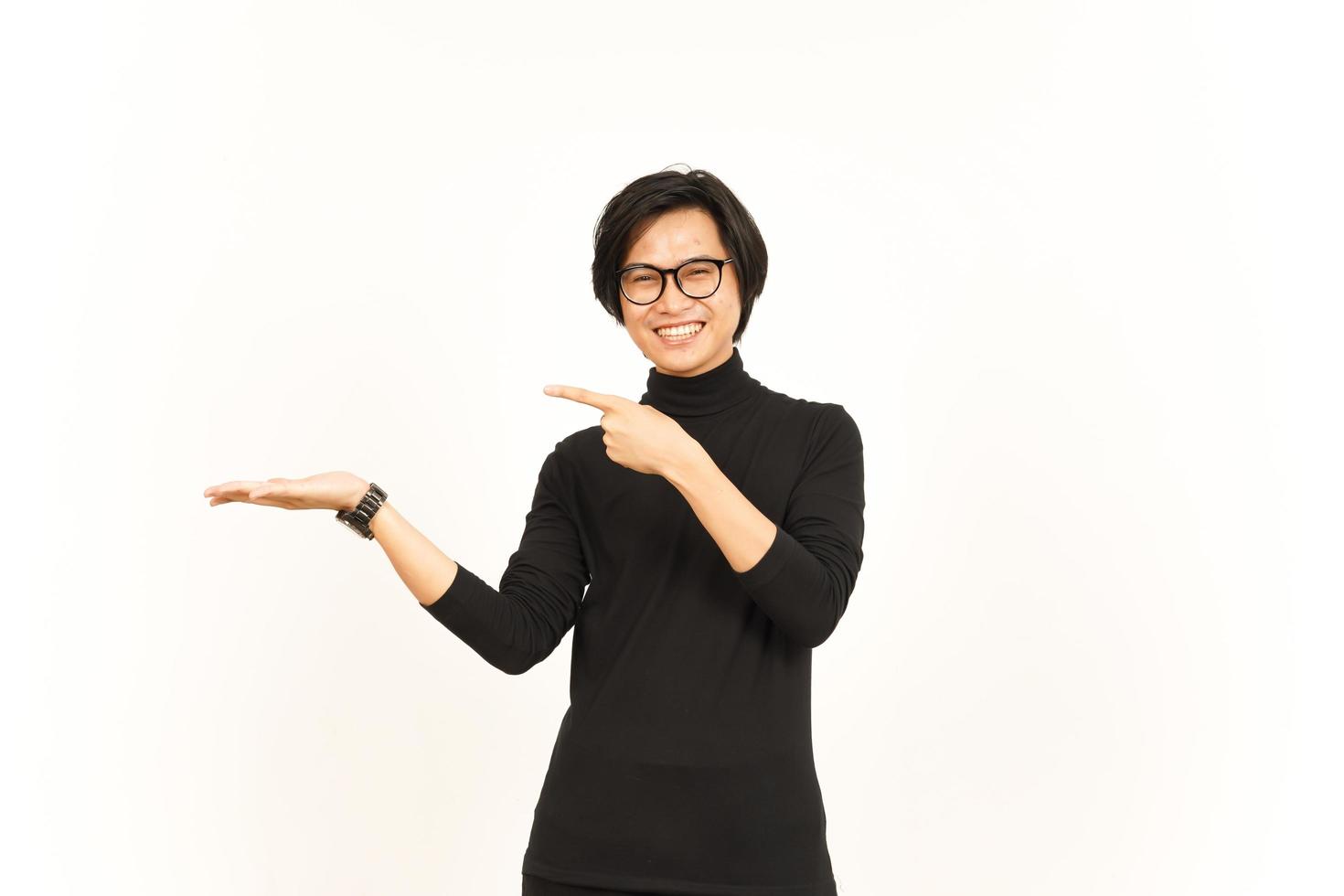 Showing, Presenting and Holding Product on Open Palm Of Handsome Asian Man Isolated On White photo