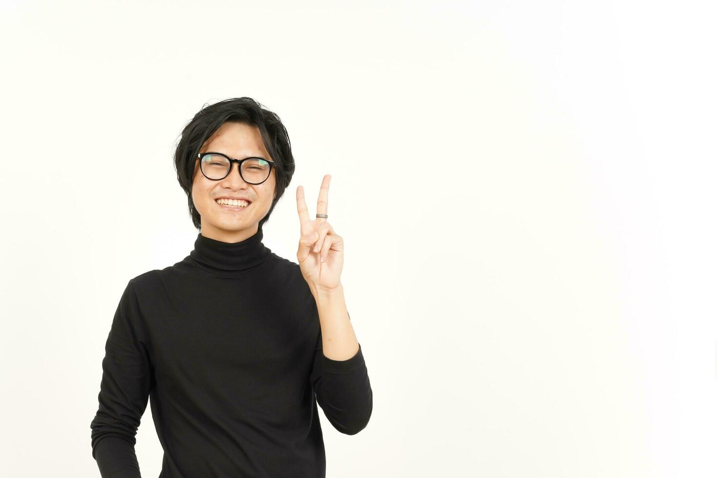 Smile and Showing Peace Sign Of Handsome Asian Man Isolated On White Background photo