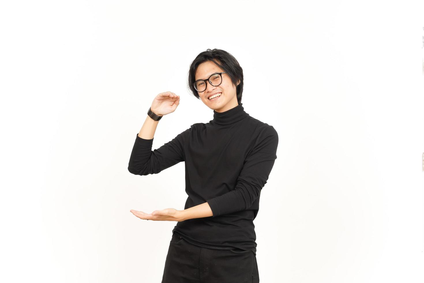 Measuring and Showing Big Sign Product Of Handsome Asian Man Isolated On White Background photo