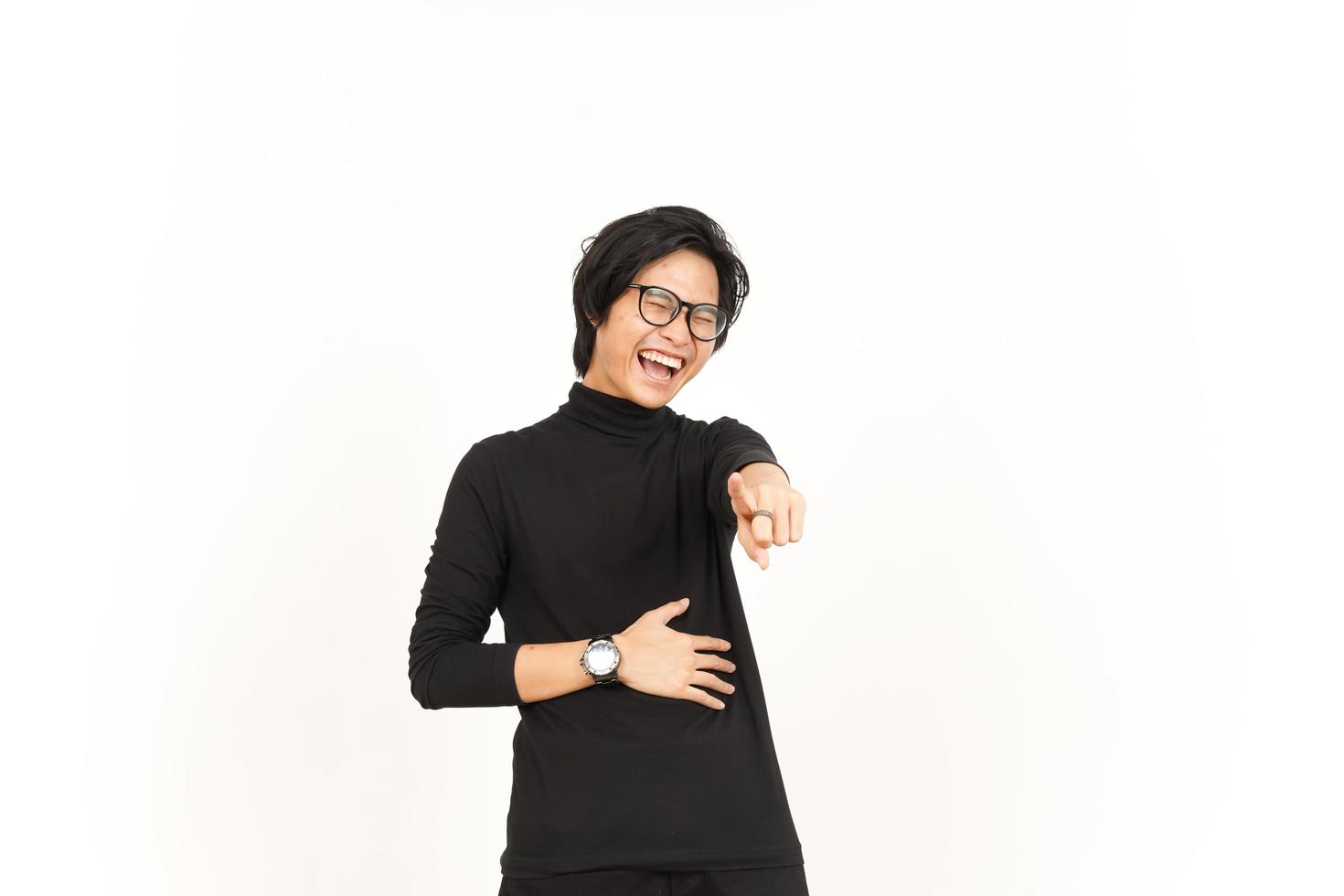 Pointing At you and Laughing Of Handsome Asian Man Isolated On White Background photo