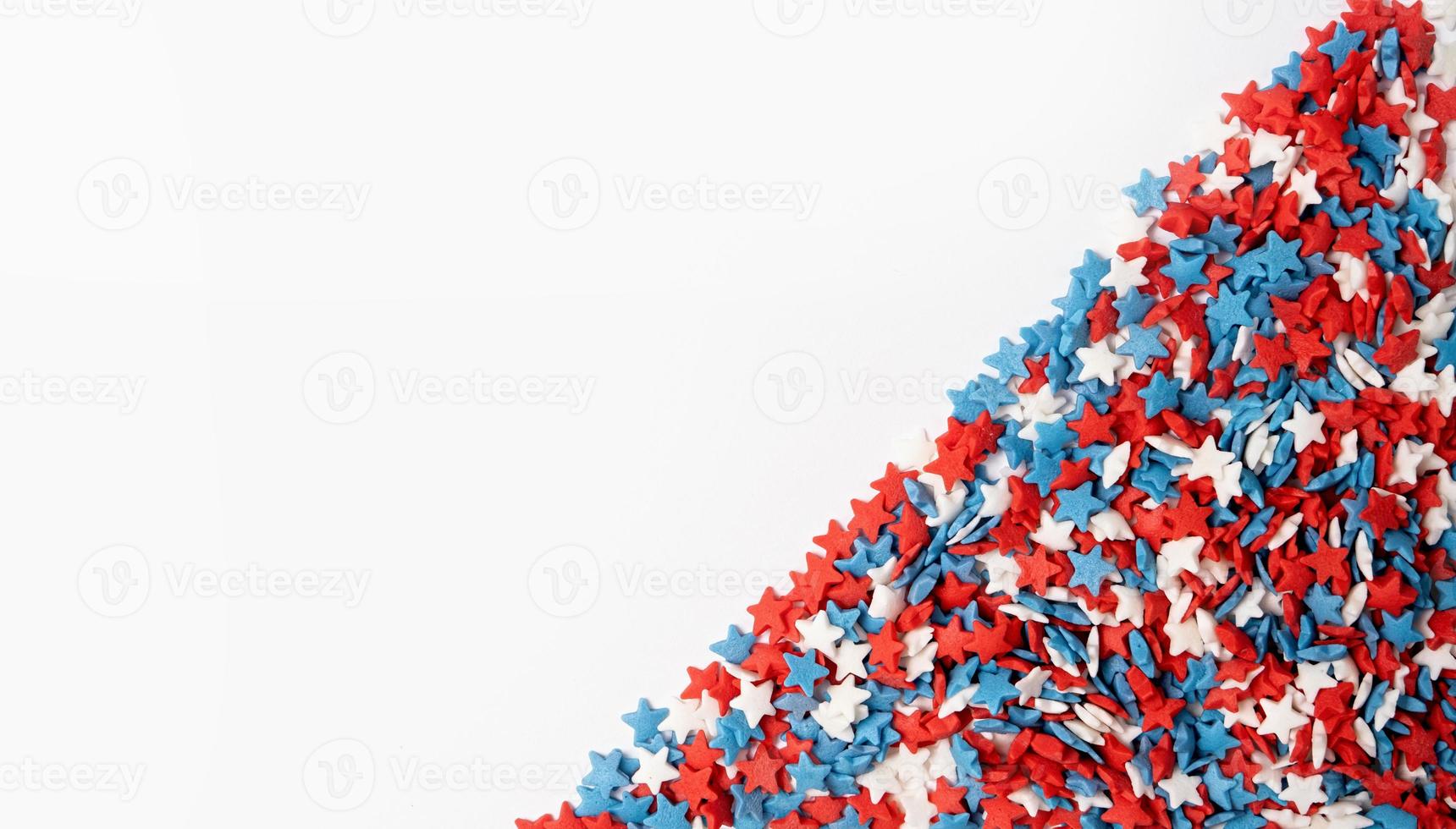 colorful star shape sprinkes decorations for fourth july , copy space photo
