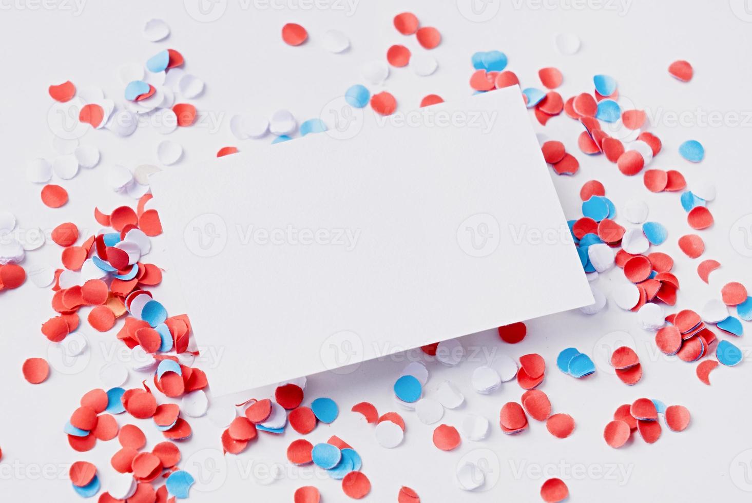 business card mockup on colorful circle confetti, decorations for fourth july photo