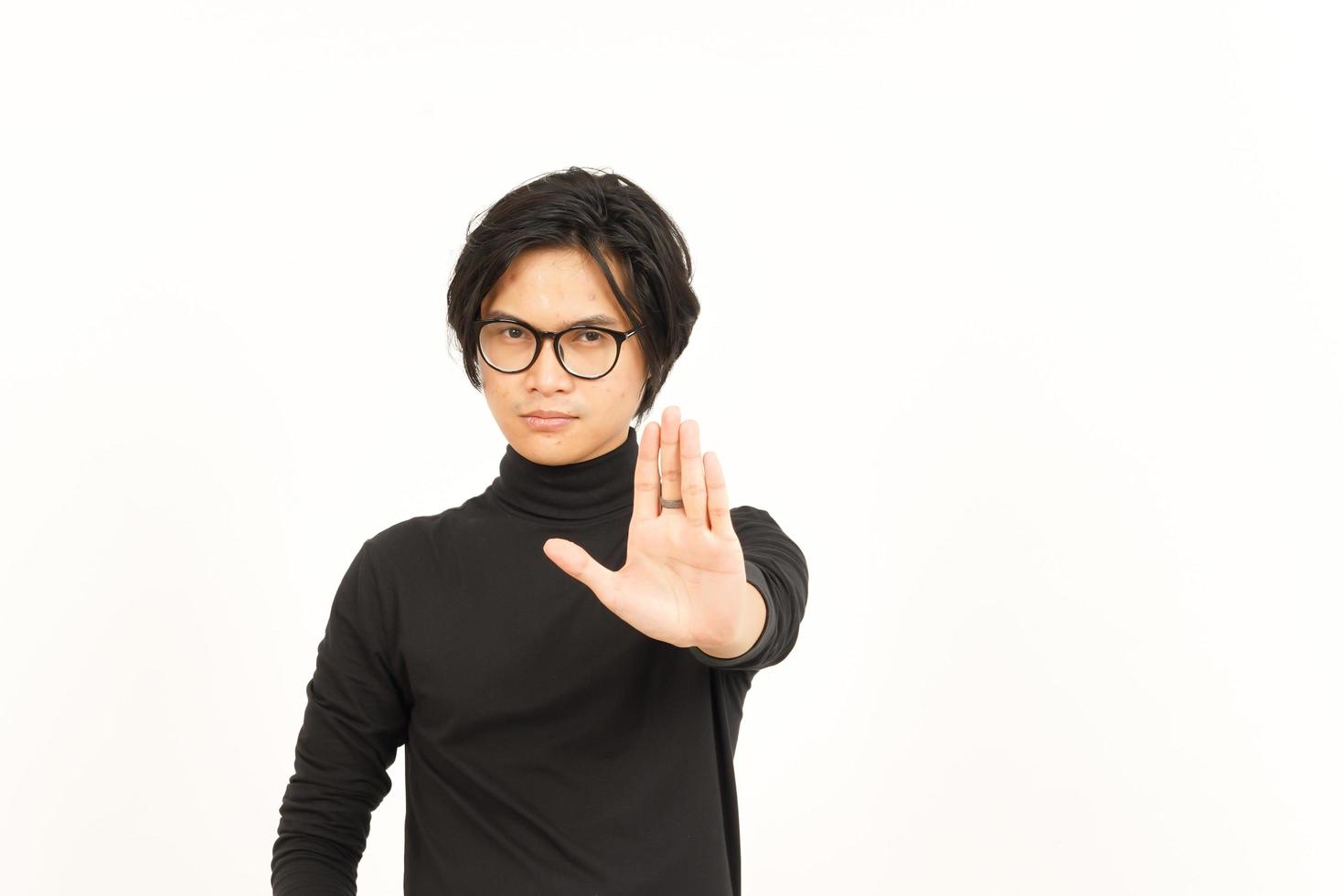 Stop Rejection Hand Gesture Of Handsome Asian Man Isolated On White Background photo