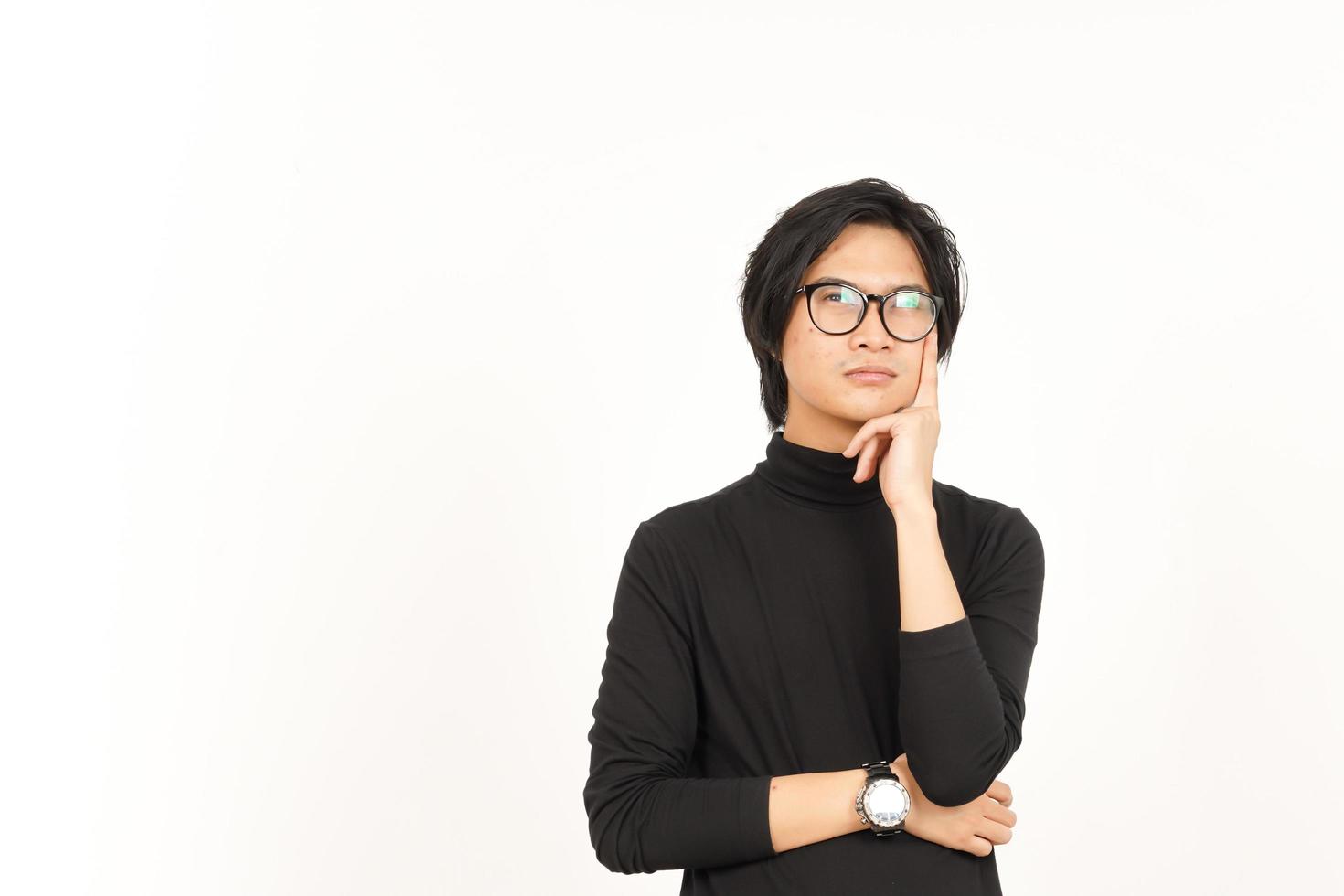 Looking up and Thinking Gesture Of Handsome Asian Man Isolated On White Background photo