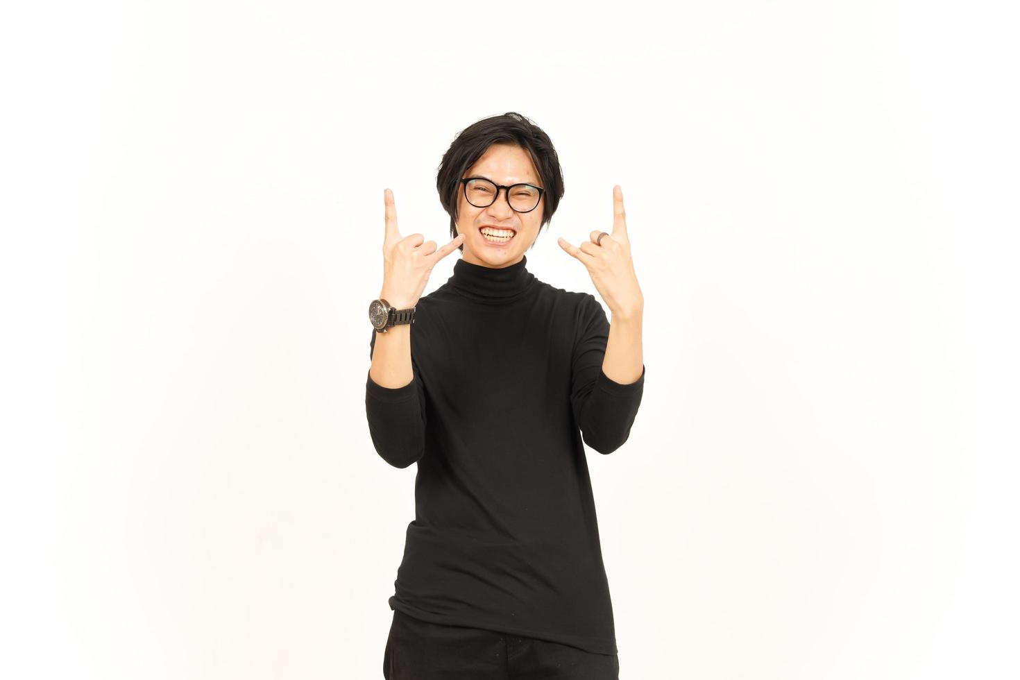 Showing Metal Hand Sign Of Handsome Asian Man Isolated On White Background photo
