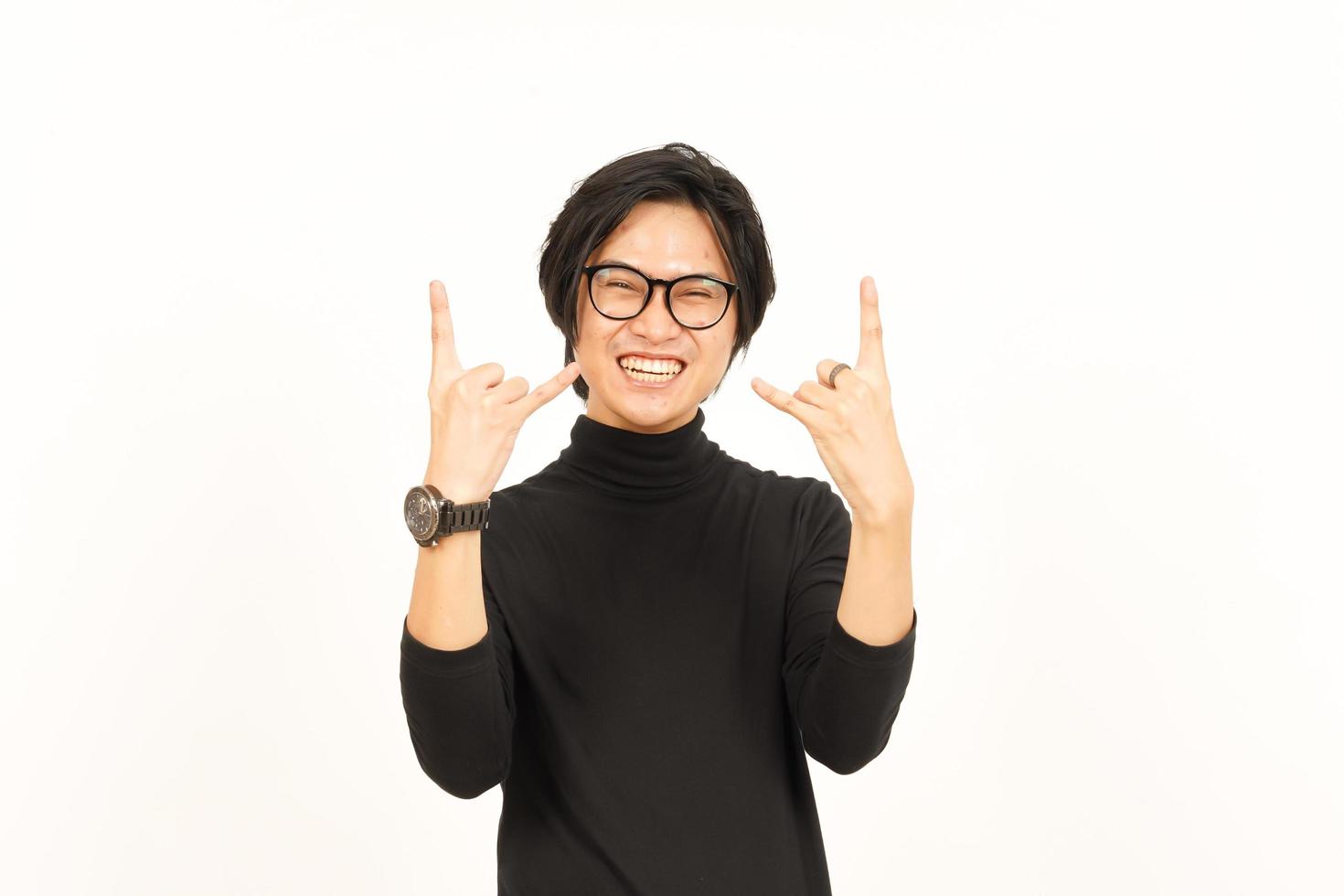 Showing Metal Hand Sign Of Handsome Asian Man Isolated On White Background photo