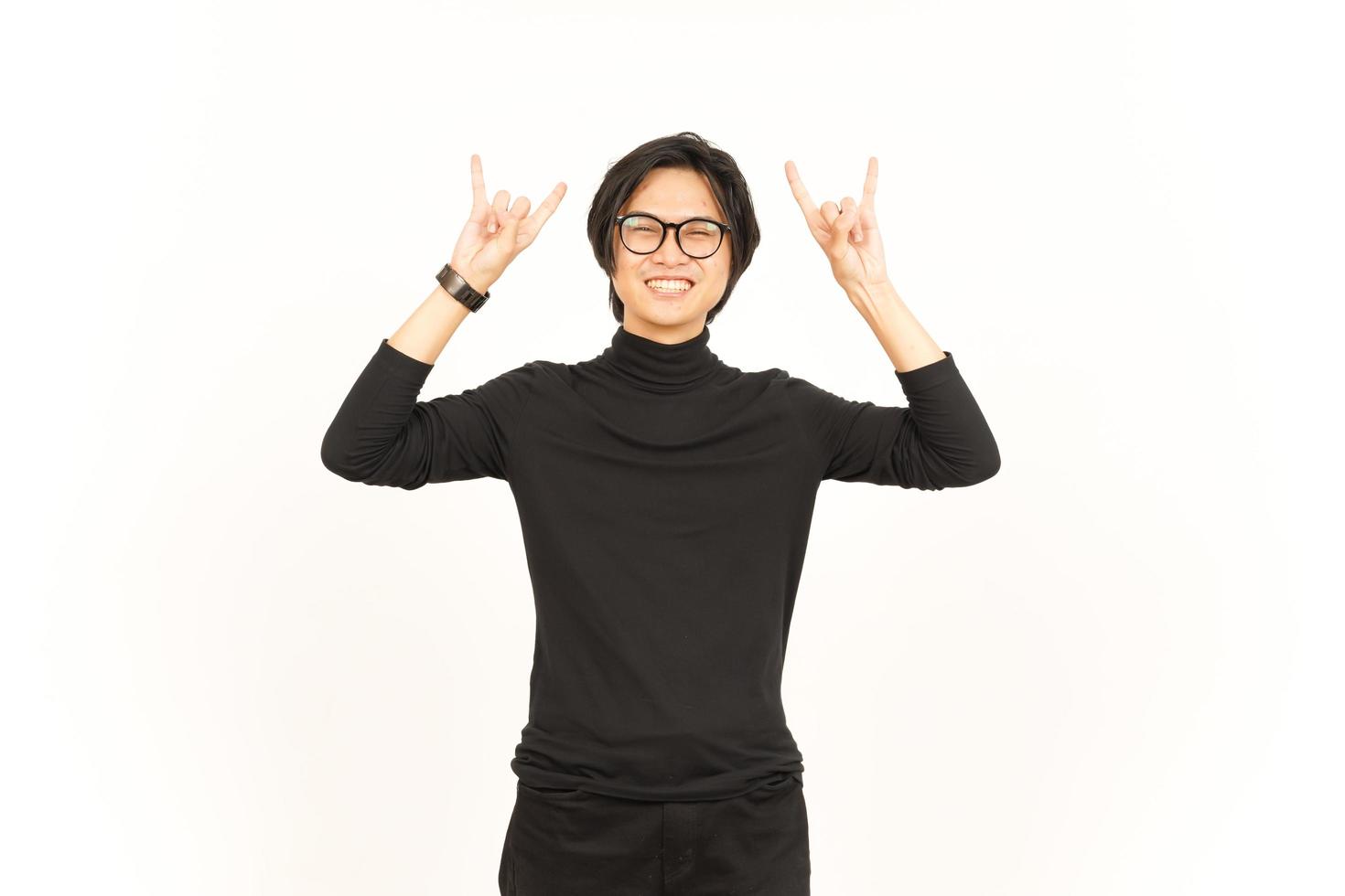 Showing Metal Hand Sign Of Handsome Asian Man Isolated On White Background photo