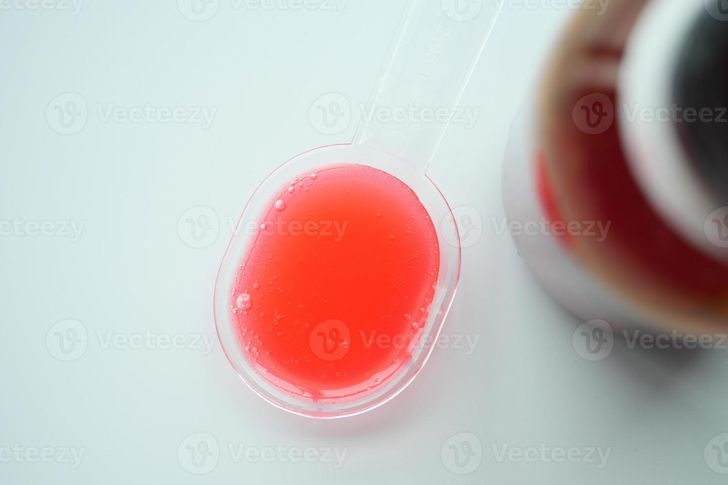 bottle with liquid medicine on white , photo