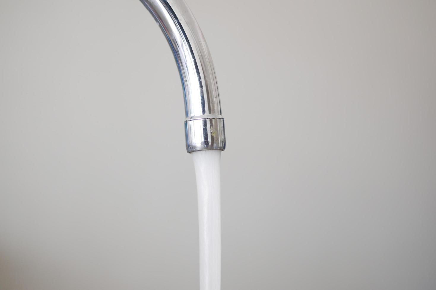 water pouring from a faucet tap slow motion photo