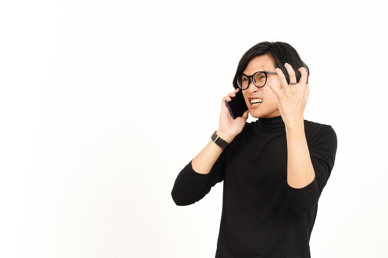 Make a Phone Call Using smartphone with Angry Face Of Handsome Asian Man Isolated On White photo